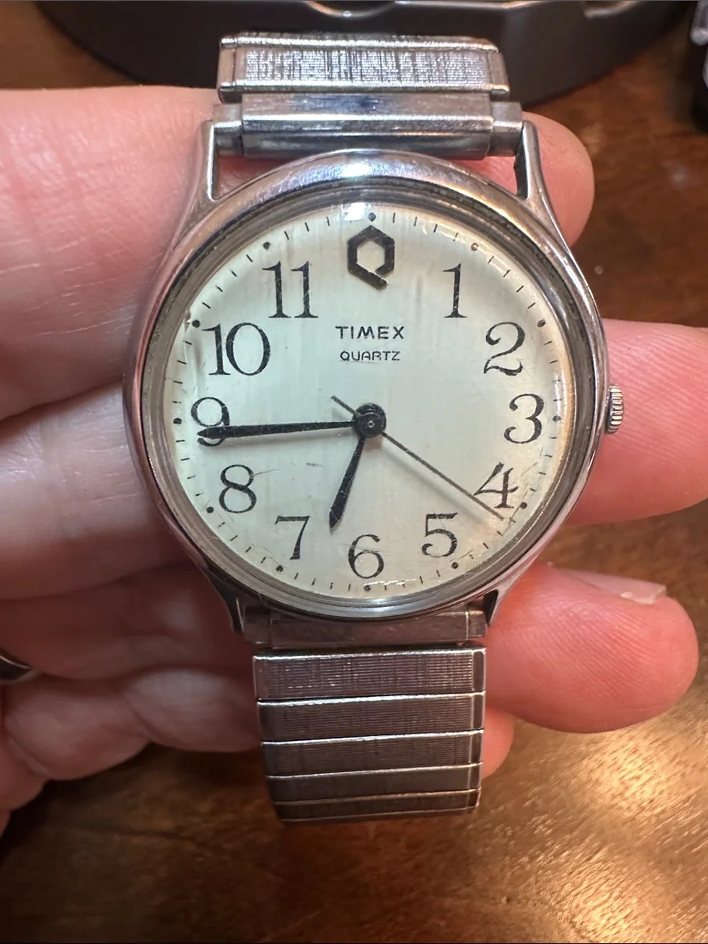 1980s Vintage Timex Men's Silver Case Watch with Cream Dial and Black Hands